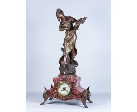 A 19th Century Red and White Flecked Marble and Gilt Metal Mounted Mantel Clock, by A.D. Mougin, No.883, the 3.5ins diameter 