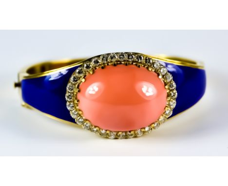 A Coral, Diamond and Enamel Stiff Bracelet, Modern, 18ct gold set with a centre cabochon coral, 20mm x 35mm, surrounded by br