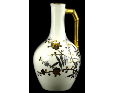A Royal Worcester porcelain ewer, decorated in aesthetic style with gilt flowering oriental style branches, with a stylised b