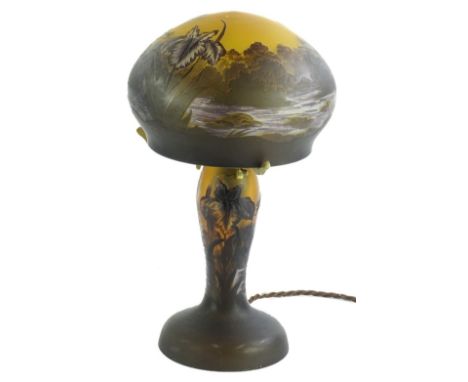 An etched glass table lamp and shade, decorated with flowers, dragonfly etc., bearing the name Galle, 34cm H.