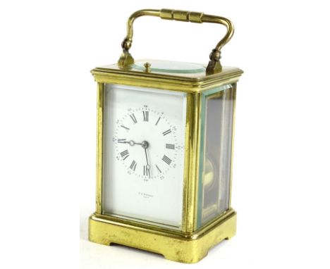 A late 19th/early 20thC French brass carriage clock, the white enamel dial with Roman numerals, marked T R Russell, Paris, th