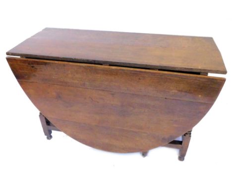 An 18thC oak gate leg table, the oval top on turned supports, with bun feet, 122cm W.