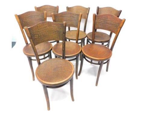 A set of seven Thonet beech bentwood chairs, each with a pressed simulated scale back and circular seat, on splayed legs, som