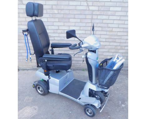 A Quingo Vitess mobility scooter made by Quintell and battery charger.