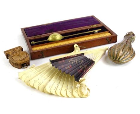 Miscellaneous items, to include a carved bone fan, a black forest type watch stand with gold plated case, powder flask etc.