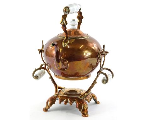 A Victorian copper kettle and stand, with ceramic handles and knop on a leaf cast square base, 35cm H.