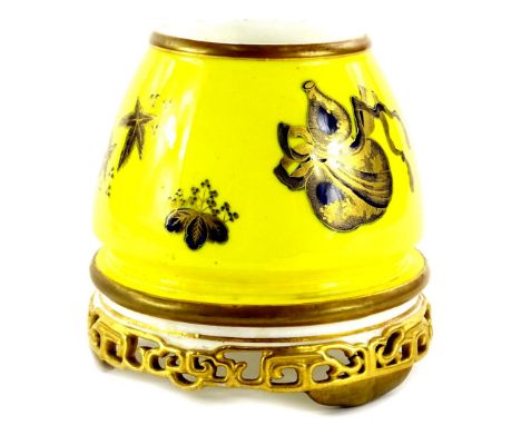 A Royal Worcester oriental style vase, decorated with fans, vessels, etc., in gilt cobalt blue on a yellow ground, with a pie
