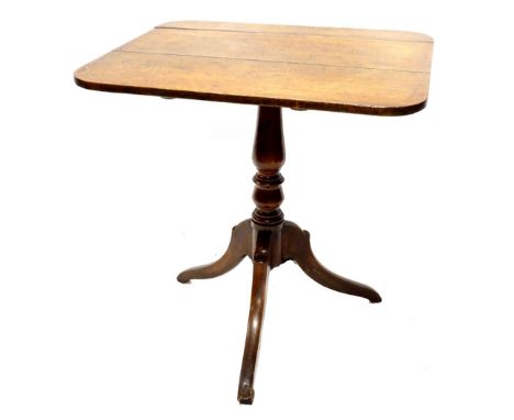 An early 19thC mahogany occasional table, the rectangular top on a turned column and tripod base, 68cm W.