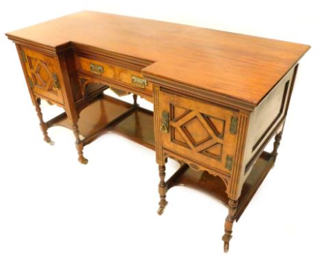 A Victorian aesthetic movement dressing table, the inverted bow front top above a burr veneered drawer, flanked by similar pa