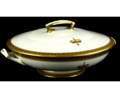 A Royal Worcester porcelain tureen and cover, retailed by Waring and Gillow, decorated to the lid and base with a crown and F