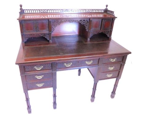 A late 19th/ early 20thC Edwards and Roberts writing table, in Chippendale style, the raised back with a pierced gallery, abo