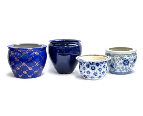 Interior design interest: Four large ceramic planters, one heightened in gilt, the smaller blue and white planter made in Vie