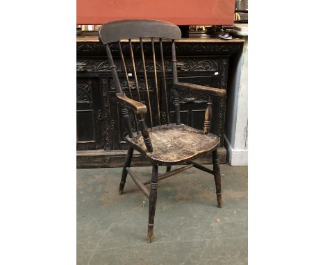 An ash and elm stickback open armchair on ring turned legs and H stretcher 
