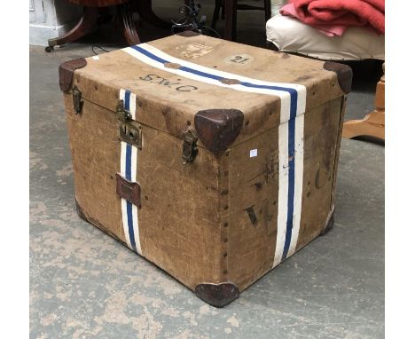 A vintage canvas and leather travel trunk, monogrammed S.W.C and glass panel for use as coffee table, 62x52x50cm 