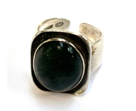 A silver 1970s Modernist ring set with a moss agate cabochon, hallmarked for Smith &amp; Ewen, Birmingham, 10.2g 