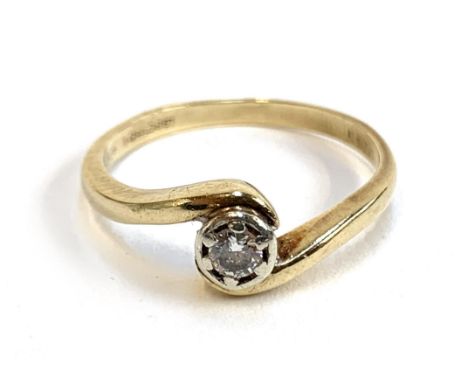 A 9ct gold ring with a crossover set diamond, the diamond 3.8mm diameter, size P 1/2, 2.6g 