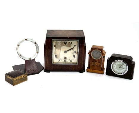 An Art Deco style mantel clock; a smaller bakelite mantel clock; a small oak and marquetry mantel clock; a faux tortoiseshell
