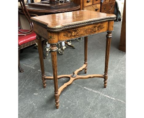 A Dutch tulip wood and pen work card table, with gilt metal mounts, on fluted tapering legs, shaped stretcher with pineapple 