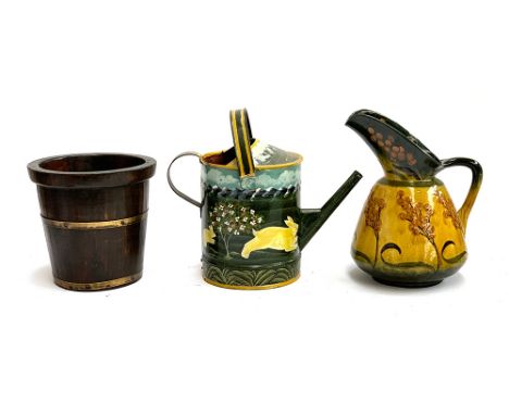 A large Foley 'Faience' green and yellow glazed jug with prunus design, 32cmH; A tole ware watering can painted with a rabbit