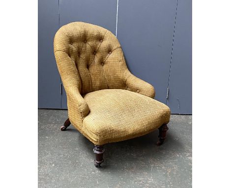 A 19th century button back slipper chair, yellow upholstered, with turned front legs and casters, 58cmW 