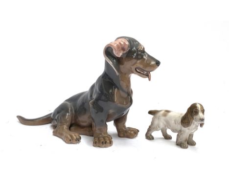 Two Royal Copenhagen figurines: 856 dachshund, and a small spaniel, 18cm high 