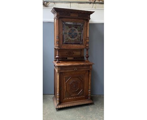 A late 19th/early 20th century Continental buffet with lead glazed stained glass panel door, over a base with drawer and geom