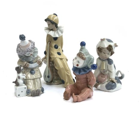 Four Lladro figurines, three stamped Nao, to include child dressed as cow, no. 1415, child dressed as clown with puppy, child