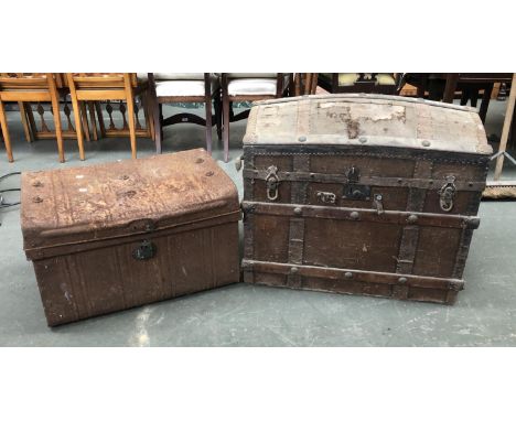 A canvas covered domed travel trunk, 78cmW; together with a further metal travel trunk 