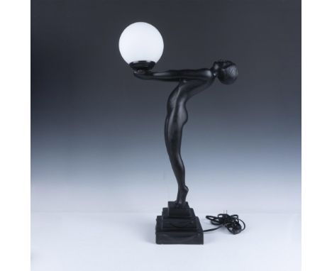 Gorgeous black toned metal figural lamp, featuring an elegant naked figure of a woman with her back arched and arms extended,