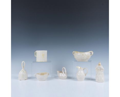 Elegant collection of cream colored ceramics that includes a double handled serving bowl, a double handled open sugar bowl, a