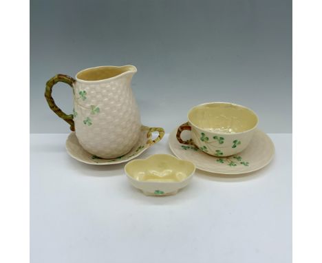 Stunning collection of shamrock decorated ceramics that includes a tea cup and saucer, a handled butter plate, a creamer pitc
