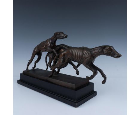 Three hand crafted detailed bronze hounds running. Set on black metal rectangular base. Issued: 20th centuryDimensions: 20"L 