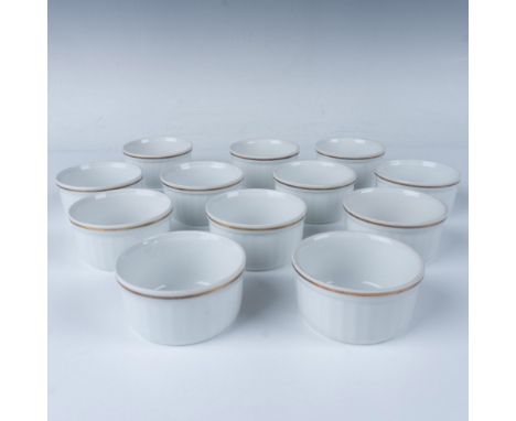A delightful set including twelve fine china ramekins with a slight ribbed pattern and adorned with a delicate gold-colored l