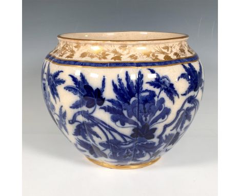 An antique glossy ceramic pot adorned with a royal blue floral pattern and elegant gilded detailing along the rim and base. B
