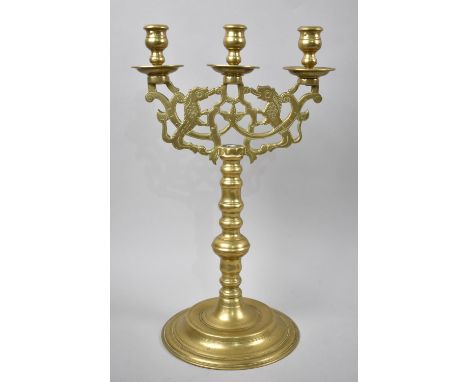 A Mid 20th Century Three Branch Brass Candelabra with Lion Rampant Decoration, 40cms High 