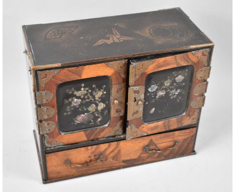 A Chinese Collectors Cabinet with mother of Pearl Inlay to Panelled Doors having Four Drawer Interior, Long Base Drawer, Bras