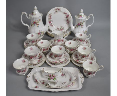 A Royal Albert Lavender Rose Tea Set to comprise Seven Cups, Rectangular Tray, Six Saucers, Six Side Plates, Five Small Plate