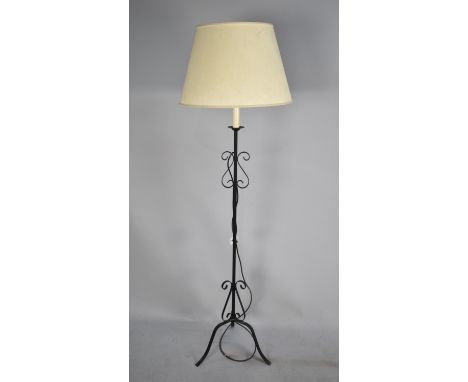 A Wrought Iron Standard Lamp with Shade 