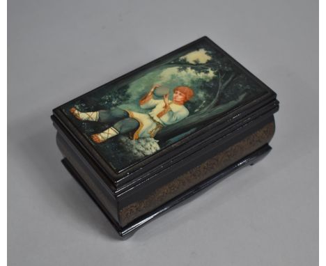 A Large Russian Rectangular Lacquered Box, The Hinged Lid Decorated with Fairy Tale Subject and Inlaid with Mother of Pearl, 