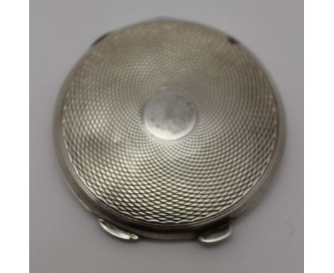 Clark &amp; Sewell, a circular silver powder compact, engine turned decoration, opens to reveal mirror, mesh and applicator, 