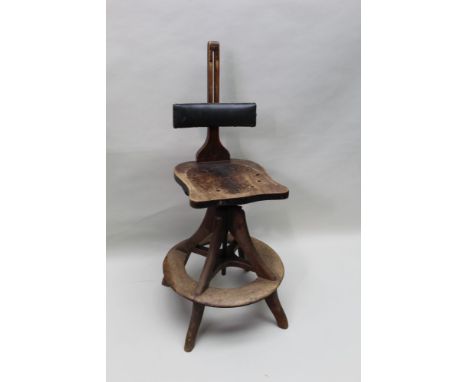 A late 19th and early 20th century adjustable wooden child's portrait chair, having adjustable bar back and seat height suppo