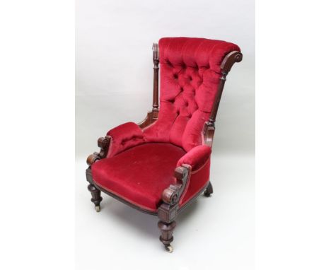 A first quarter 19th century mahogany show wood framed ladies lounge arm chair, having all over claret chenille upholstery wi