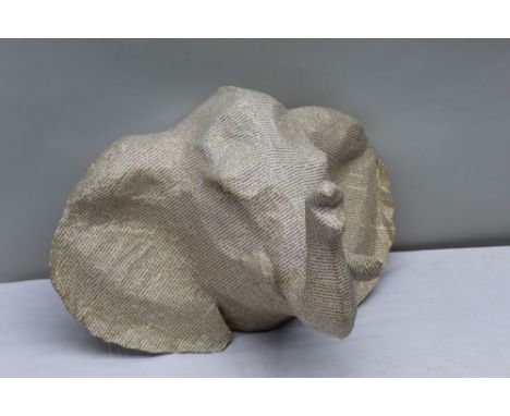 A hand made papier mache elephant's head, all over decorated in French script, wall mountable, approx 40cm high, 43cm from wa