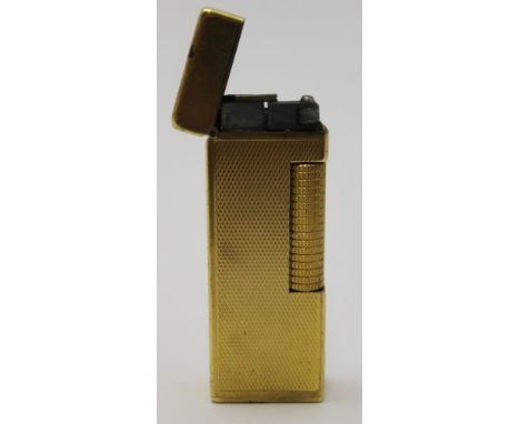 A Dunhill gold plated Rollagas lighter, barley finish, stamped to the base 'Dunhill, made in Switzerland, patented' (design i