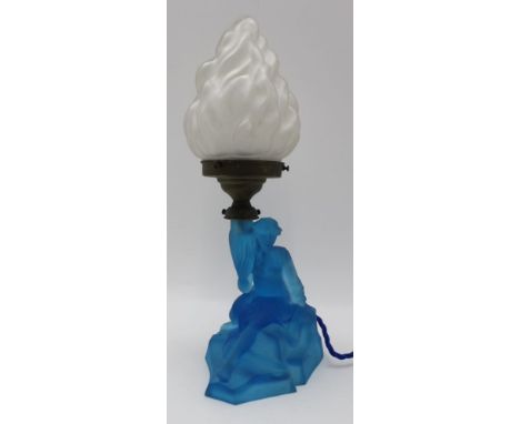 An Art Deco Walther & Sohne 'Rotterdam' table lamp, a German blue moulded satin glass base, depicts a Sea-siren on a rocky ou