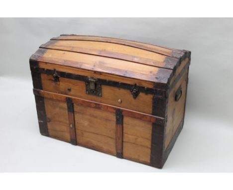 A late 19th / early 20th century metal bound wooden staved dome topped steamer trunk, typical form and construction, approxim