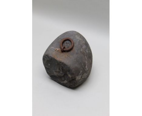 A horse tethering stone, with inset securing ring, the stone carved with number '68', 28cm high 