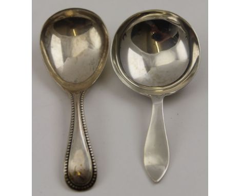William Hutton &amp; Sons Ltd. A silver caddy spoon, Sheffield 1926, together with one other silver caddy spoon, having beade