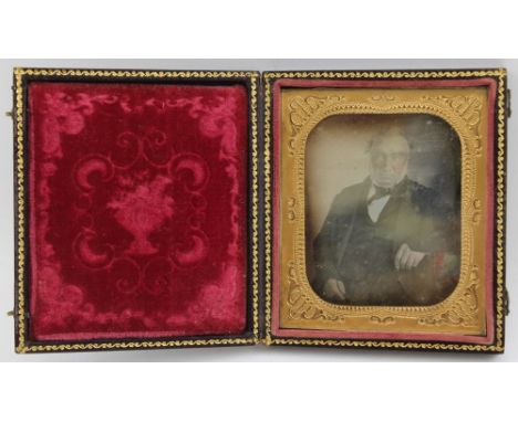 A 19th century daguerreotype, portrait of a gentleman in embossed case, velvet lined with a gilded mount, image size 6cm x 5c