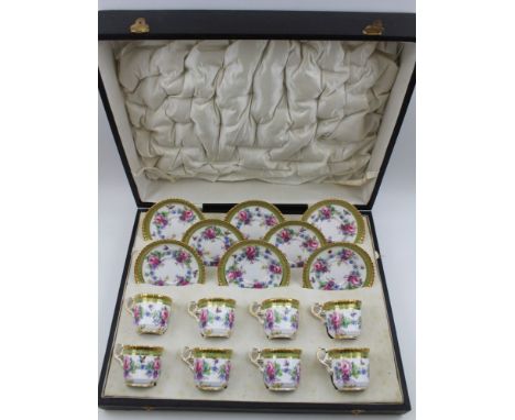 A Copeland Spode porcelain set of eight coffee cups & saucers, rose garland and butterfly decoration, gilded rims, factory ma